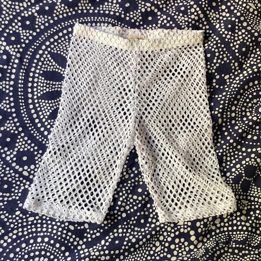 White fishnet bike shorts.